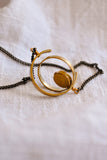 Oxidized Sterling and Gold Spinning Pendant Necklace